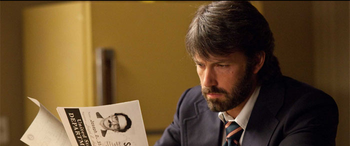 Agent Tony Mendez (Ben Affleck) creates the false identities for the six embassy workers stranded in Iran. Photo from http://argothemovie.warnerbros.com used with permission under fair use. 