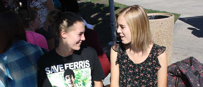 Twins Taylor and Morgan Gillespie socialize at lunch. Photo by RACHEL MACKENZIE