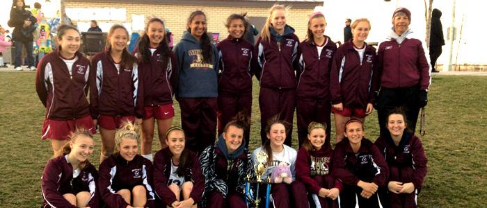 The girls' varsity soccer team poses with their first place trophy at the Cal Spring Classic on Feb. 23. Photo by 