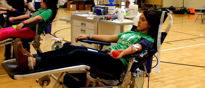 Junior Kori Silva gives blood at the blood drive on March 5. Photo by KAVYA PATHAK. 