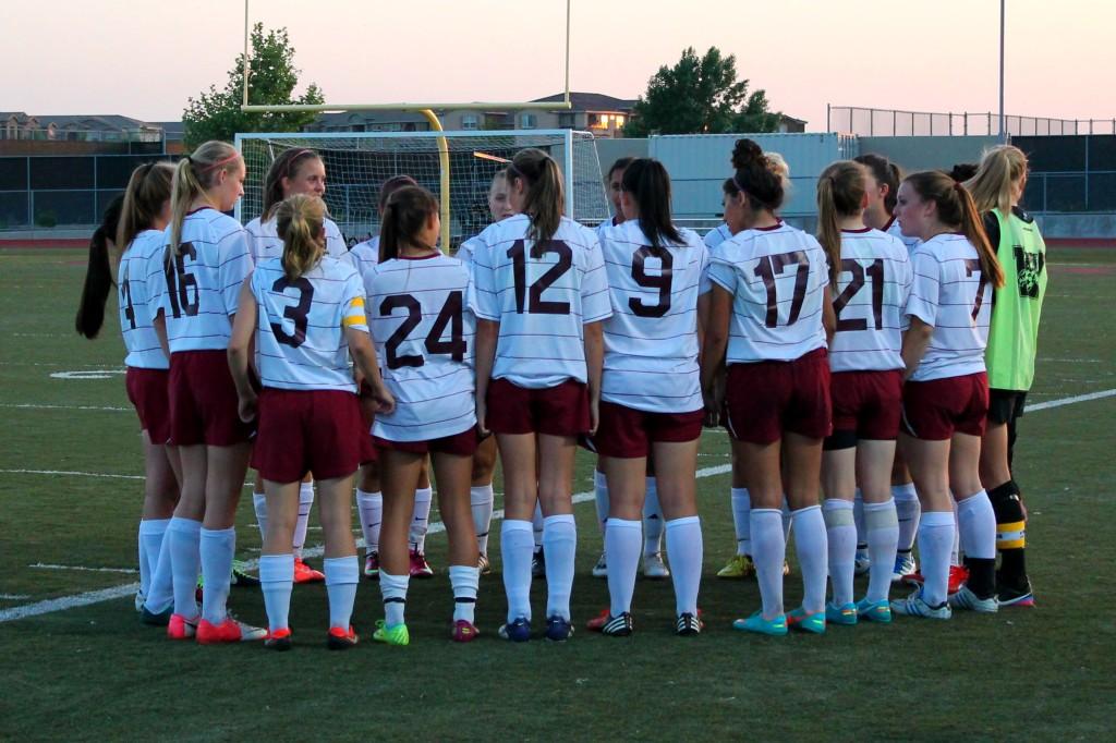 Girls+soccer+hold+each+others+short+in+their+pregame+ritual+for+the+last+time+in+front+of+their+home+fans.