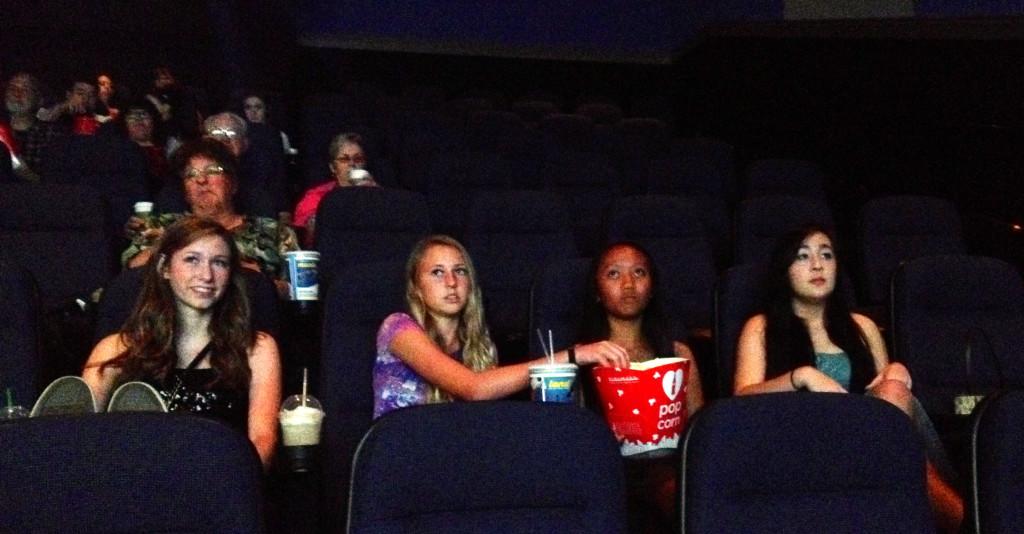 Kaitlyn Townsley, Haley Peffereman, Sarah Martinez and Noelani Cairns watch Prisoners in their Homecoming dresses at Blue Oaks Century Theatres.