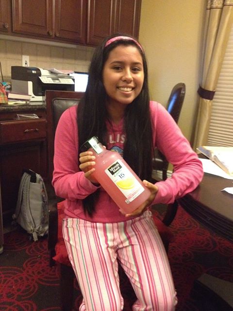 Kristen El Sayegh is dressed in pink and holding a bottle of pink lemonade. Photo by JON EL SAYEGH 