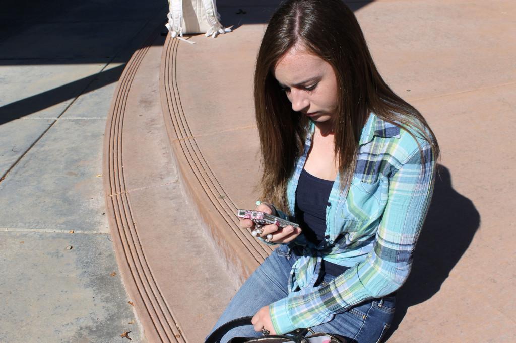 Samantha Garabedian reads her texts during school hours. Photo by HAVEN LAMBRITE