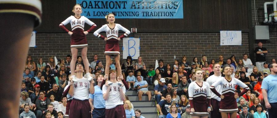 Zach Roberts and Ian McQueen one-man stunt Alexa Donald and Elizabeth White at the Oakmont Cheer Competition in January. Photo by Rylea Gillis.