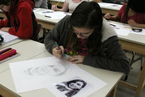 Students in Art I create self-portraits