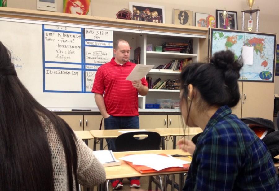 Mr. Travis Mougeotte teaches his world history class, one of the three subjects he currently teaches.