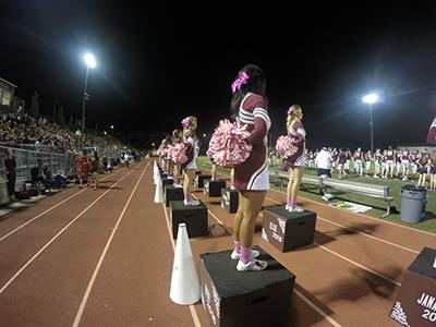 Cheerleaders get ready to entertain the crowd