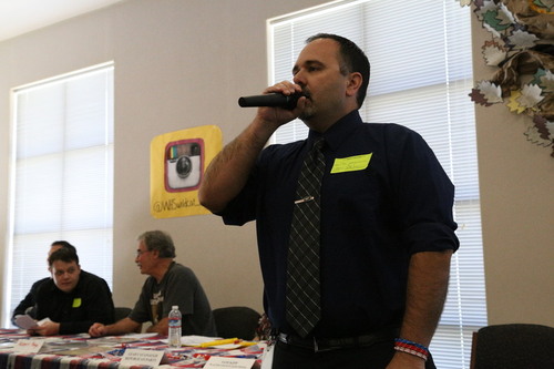 Organization volunteer introduces the Libertarian representatice Robert Page on Oct. 16. Photo by Olivia Grahl