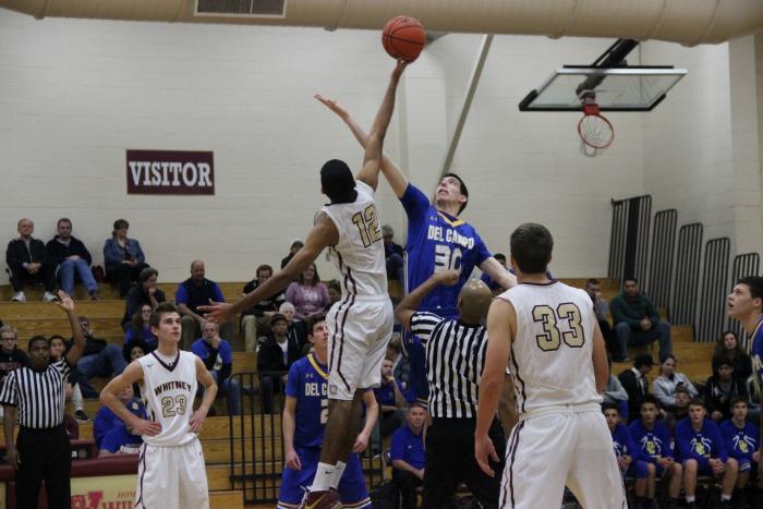 Moe Ali wins the tip-off at the beginning of the game. Photo by Daniel Sharrah