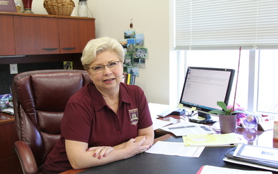 Principal Debra Hawkins sit at her desk Feb. 11. Photo by Sarah Martinez