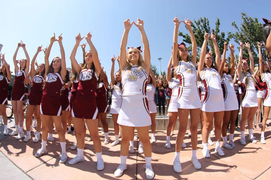JV and varsity cheer team holds up the W during Fight Song Friday. Photo by Lizzie Salvato