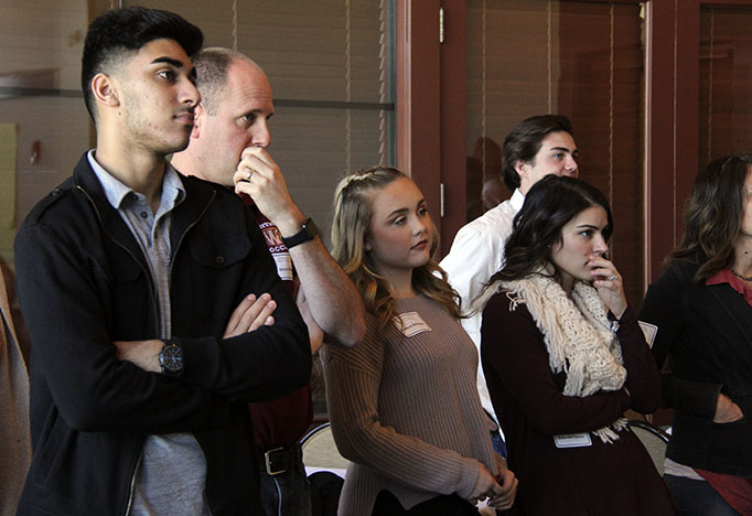 Planning committee members Atir Mirza, Mr. Erich Means, Sydney Schreiner and Katie James look at the screen displaying what the team developed as the official mission statement. Photo by Rachel Marquardt
