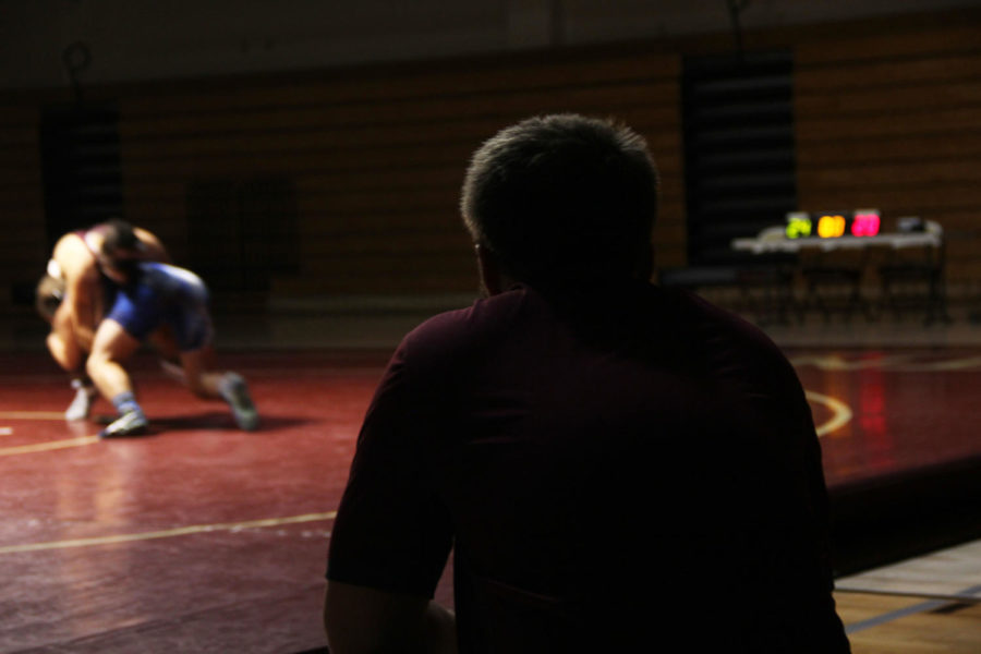 Coach Clarke Powers watches his team compete at the match against Rocklin Nov. 28.