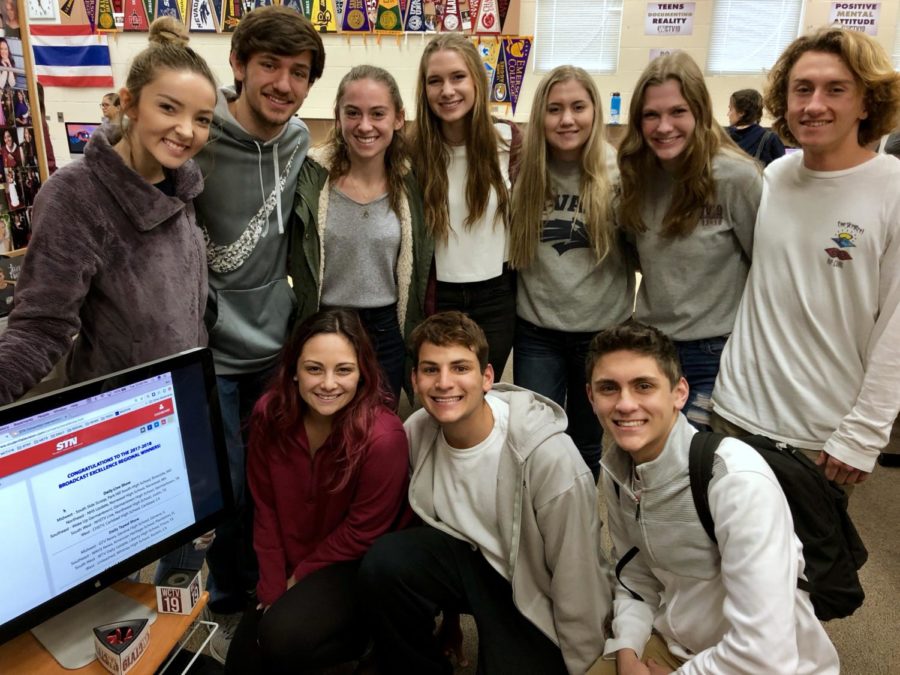 In Mr. Ben Barnholdt’s broadcast class, the leadership staff celebrates finding out they will be eligible to partake in a national competition Jan. 23. Photo by Mr. Ben Barnholdt. 