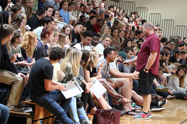 During a senior class meeting, Mr. Travis Mougeotte talks with students about graduation requirements. Photo from Whitney Update archive

