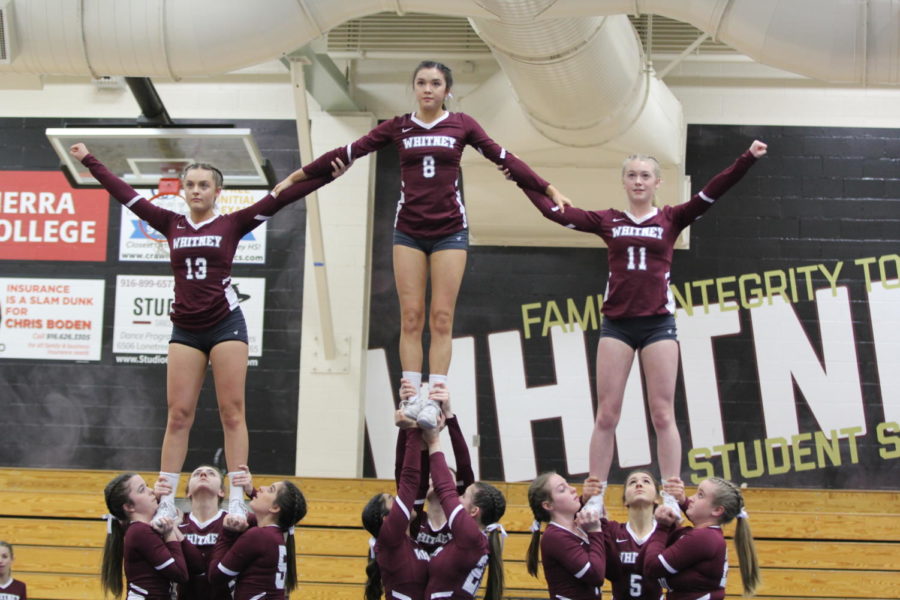 In level one of pyramid and tosses, three stunt groups hit their final ending pose, which is two halfs and a cupie during their game March 12. Photo by AJ Cabrera.