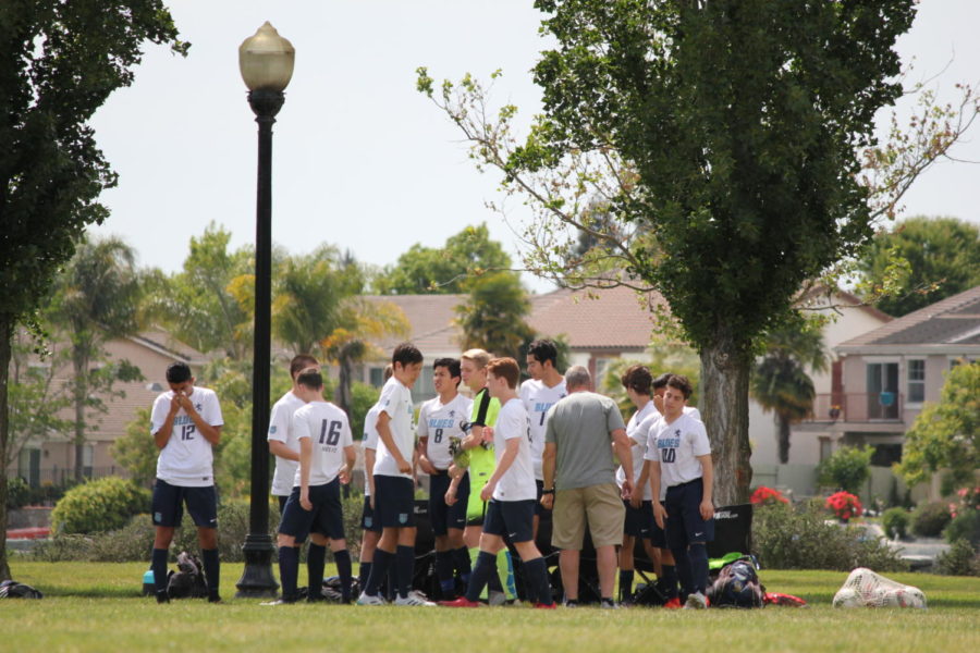 Varsity soccer players compete in club game