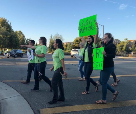 Before school, union members gather outside of campus to raise awareness of their unsettled negotiations. Photo by Emily Cowles