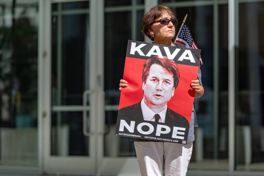 Protester against supreme court justice nominee, Brett kavanaugh, outside the Warren E. Burger Federal Building in St. Paul, Minnesota. Photo from Flickr, with permission.