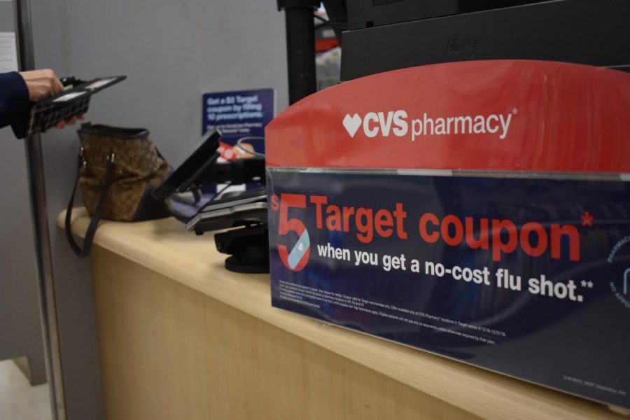 In time for flu season, Target’s CVS pharmacy promotes a deal to receive a $5 coupon alongside a vaccination. Places like Target allow individuals to have options apart from their doctors’ offices to get the shots. Photo by Grace Chang.