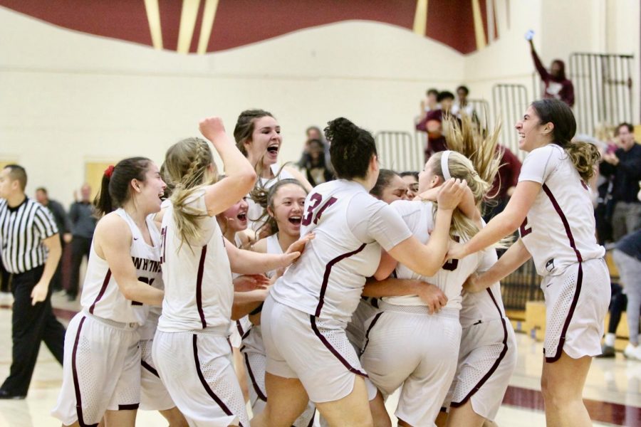 After Mazie Macfarlane made the game winning shot, the team ran on the court to celebrate their victory. Women’s varsity won 60-58.