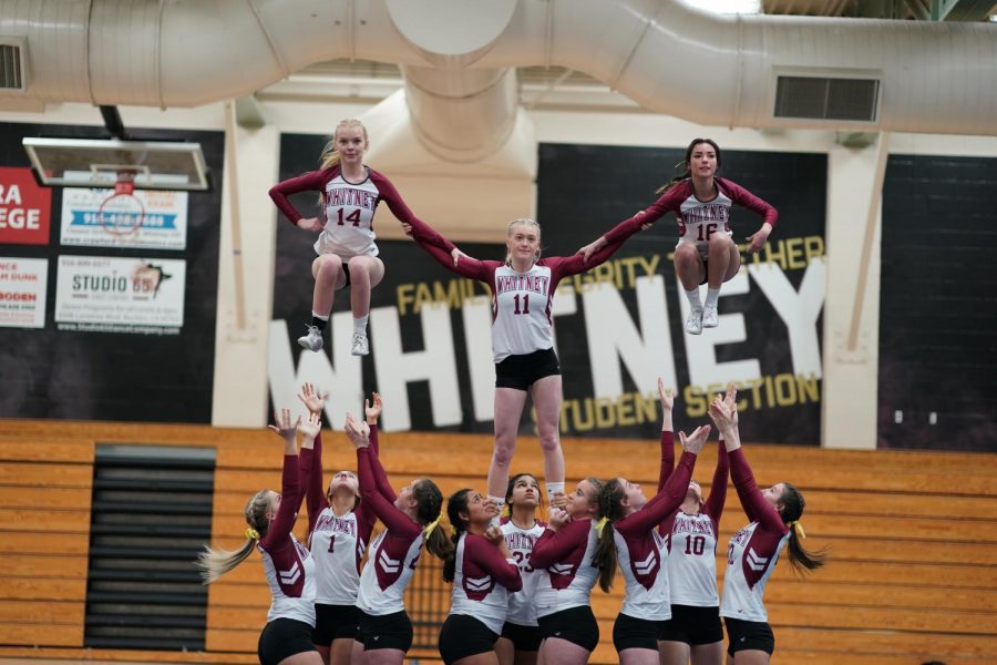 During a league game against Rocklin March 28, Kendra Roberson, Reese Phillips and Elyse Sheek stunt with their groups in Level 2 of pyramids and tosses. They won 15-14. Photo by Geoffrey Clarion.
