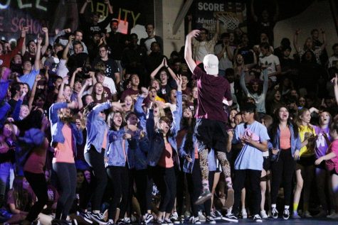 Kade Church hypes up the Junior Class as he enters the end of the year rally.
