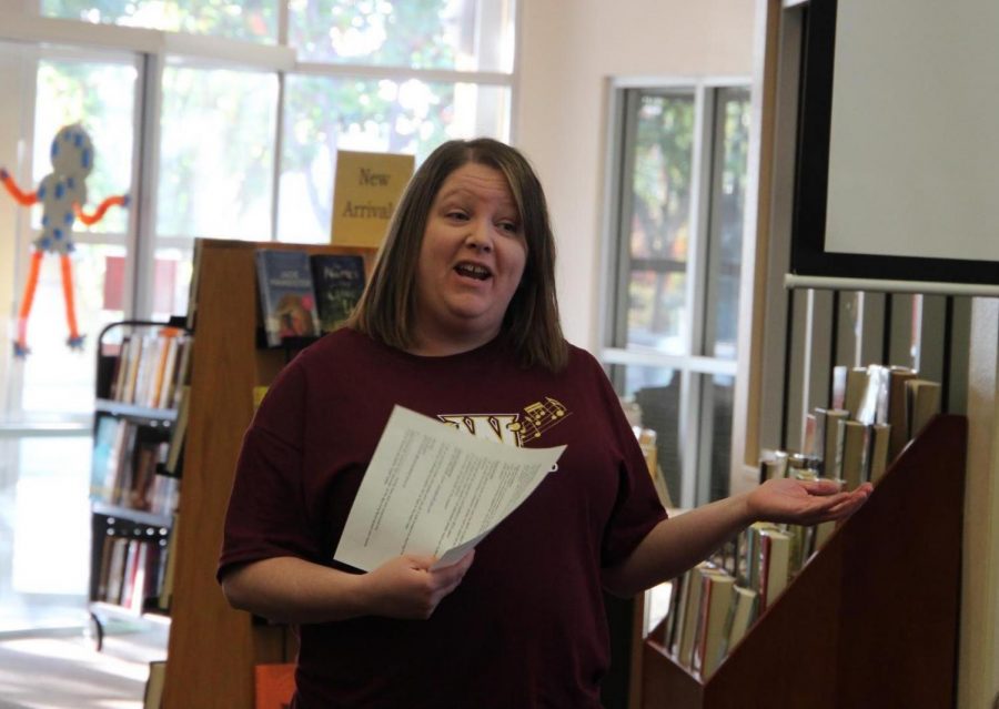 During a meeting in the library Oct. 31 at break, Mrs. Jana Kingery introduces herself to marching band members as interim director. Members were called into the library during second period in order to understand what the rest of their season was going to consist of. Photo by Dylan de Valk.