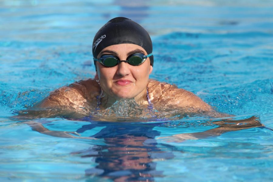 Isabella Dunkhase focuses on breaststroke during one of the last practices of the season. Photo by Dylan DeValk. 

