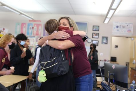 During an ice cream party celebration, Olivia Roberts embraces Mrs. Penny Shelton. Shelton threw the party as a way to say goodbye to her students and celebrate her transition from teaching to the assistant principal role. She will be starting her new position Sept. 27. Photo by Sofia McMaster. 
