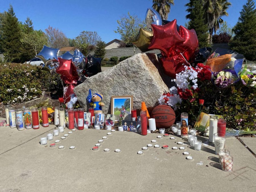 Created by friends and family, a small memorial for Anthony Williams sits across from Lucille’s Smokehouse on Lonetree Boulevard. Photo by Lexi Lopez.

