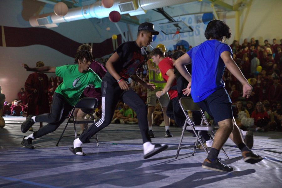 With just two chairs left in their game of musical chairs, students sprint around the chairs to bring in an extra challenge. Photo by Alyssa Folmer.