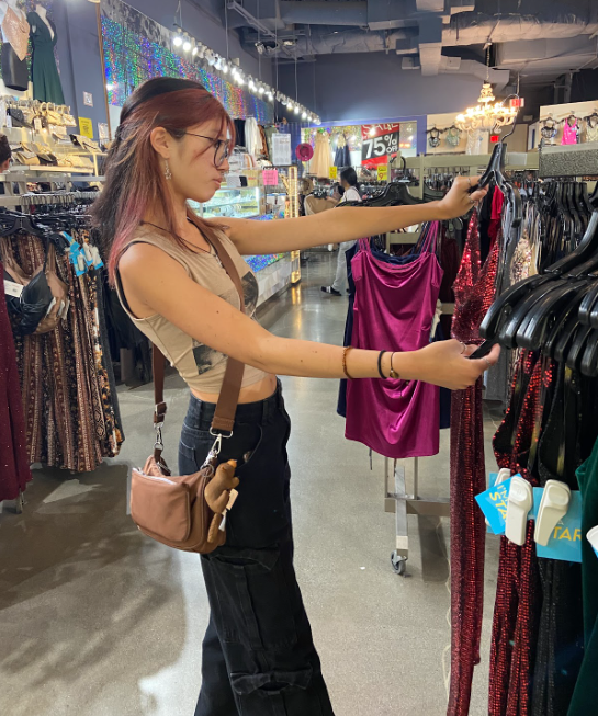 As Homecoming approaches, Koda Cedor decided to look around on Sept. 10 at the “I’m a Star,” store for their homecoming dress. Photo by Izzy Lenik.
