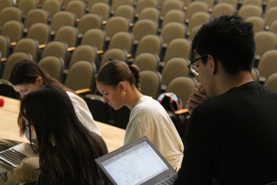 In pre-production for the upcoming Lenaea festival, Theater IV student Armaan Sharma reviews and discusses their One Act script with the class in preparation of being on stage. Photo by Liliana Galdarisi