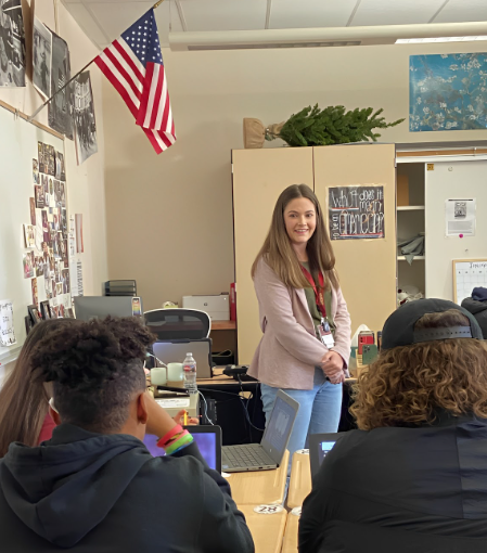 Taking over her first lesson plan as a student teacher in fifth period U.S. History, Ms. Courtney Crowe presents notes regarding the New Deal. However, students also attempted to take this as an opportunity to ask questions about Crowe. Photo by Izzy Lenik.