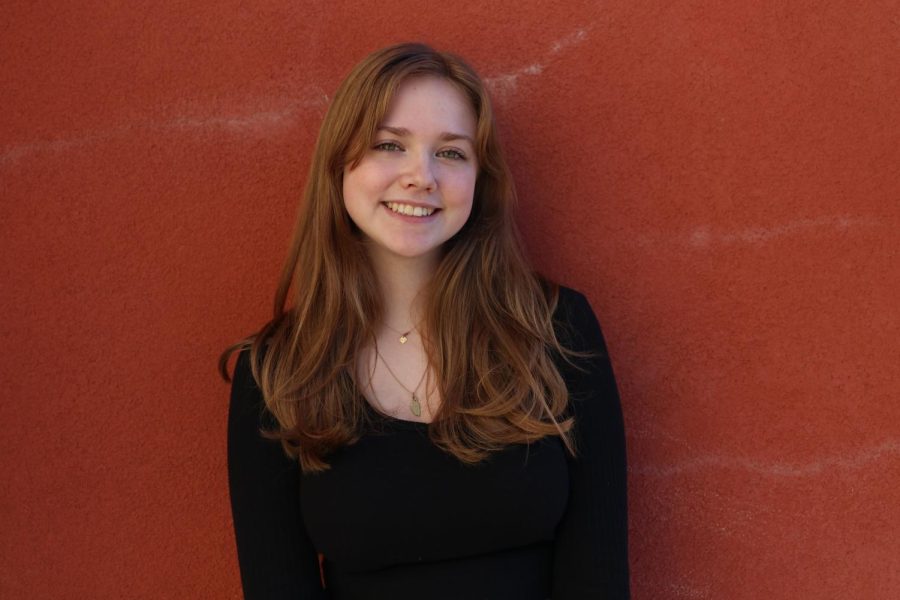 Elise Nippert poses for a photo outside C-2 during PAWS Feb. 8. Photo by Alexis Dashnyam