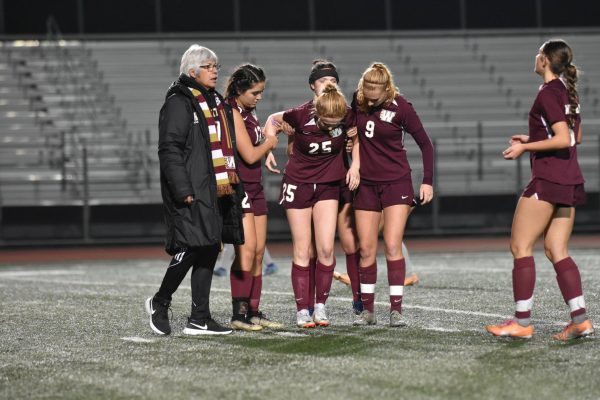After hurting her ankle, Izzy Hernandez gets help off the field from her teammates. During the women’s varsity soccer game against Franklin Dec 5, Hernandez is injured on the field causing her to need help to walk. The game ended with a score of 2-1, Franklin. Photo by Caitlyn Arca.