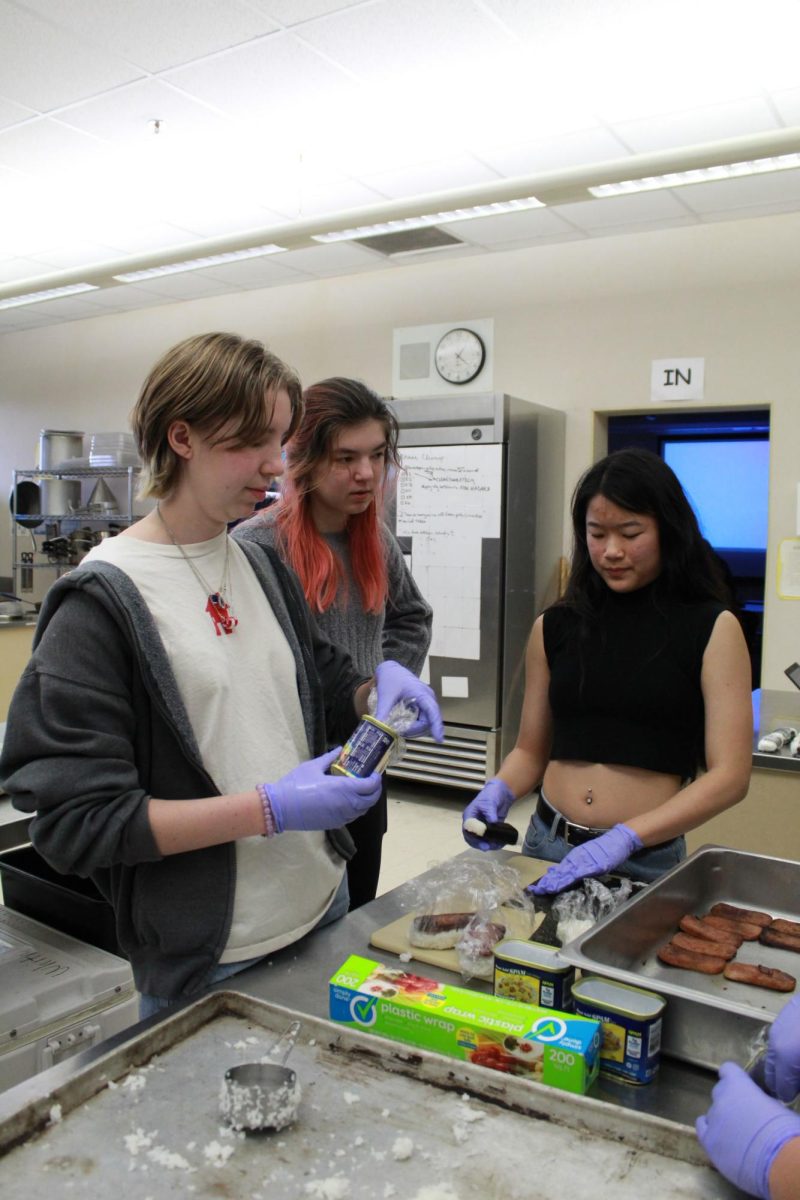 During lunch Feb. 7, Sam Marques, Madison Meyers and Rose Li assemble spam musubis in the culinary kitchen. AYLA and Cooking for a Cause Club hosted a spam musubi fundraiser for their club selling through Feb. 2-6. Photo by Jezlyn Sotelo