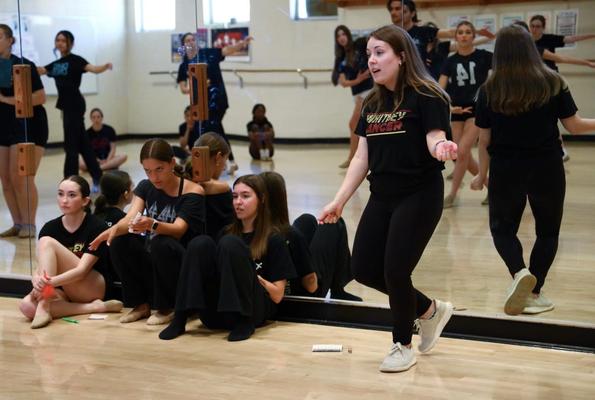 In sixth period Dance II/III, Mrs. Mallory Ansley performs a balancé to guide students through the move while cleaning their second routine for the Advanced Dance Showcase. In an email April 12, Ansley announced her resignation from her position as a dance teacher for the 2024-25 school year. Photo by Isabella Tomasini