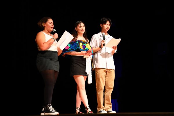 Opening the Multicultural Fest, Black Student Union Vice President Samira Jackson, Hispanic and Latin Culture Club President Celeste Ruiz and Asian Youth and Leadership Association Club President Justin Kuo welcome the audience to the show in the theater. Photo by Desiree Montejano.