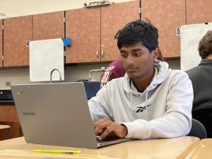 After completing his classwork, Aditiya Korde reviews vocab terms to prepare for the AP World History exam May 7.
