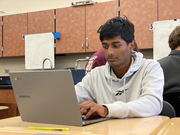 After completing his classwork, Aditiya Korde reviews vocab terms to prepare for the AP World History exam May 7.